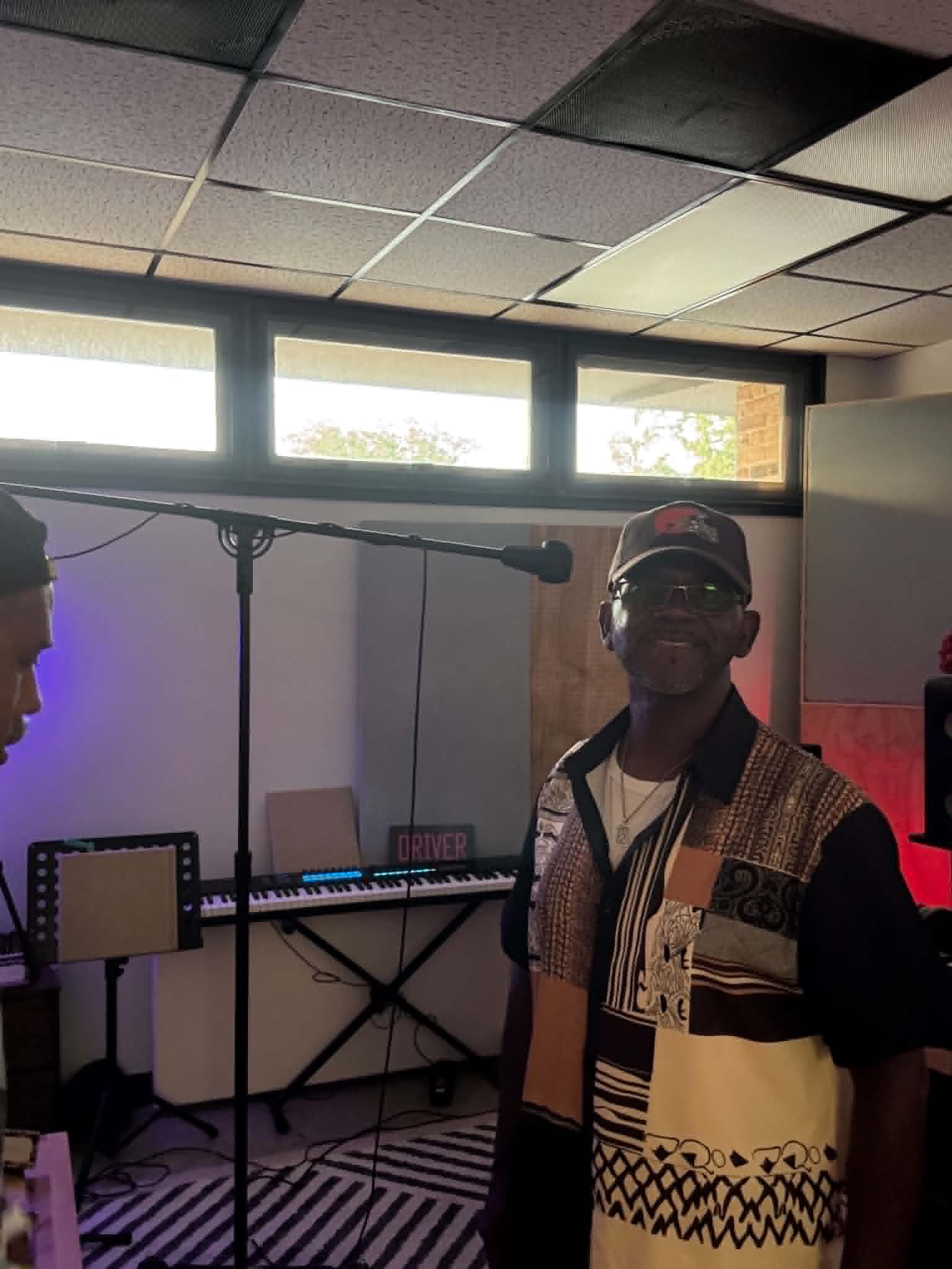 Recording booth with microphone, red and blue studio lighting