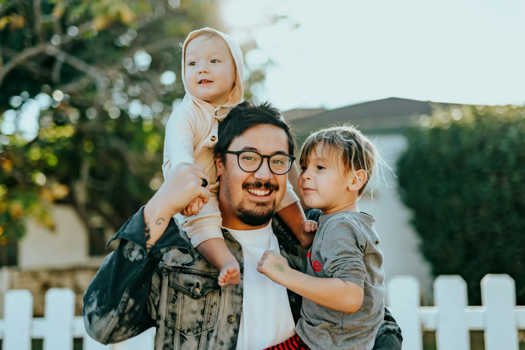 A family standing together outdoors. Conceptual family imagery, not a photograph of Charles's family.