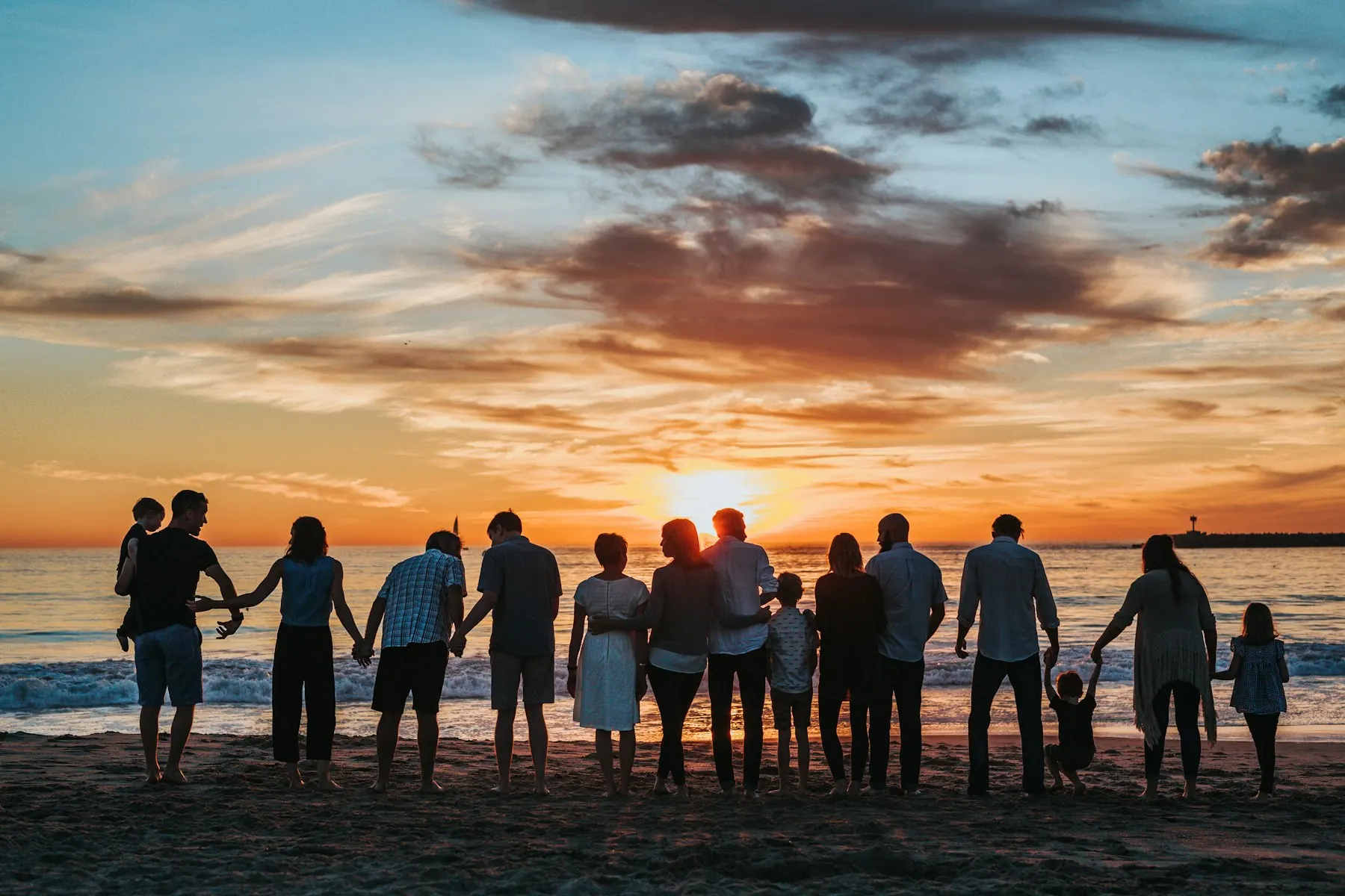 A family walking together outdoors. Conceptual family imagery, not a photograph of Charles's family.