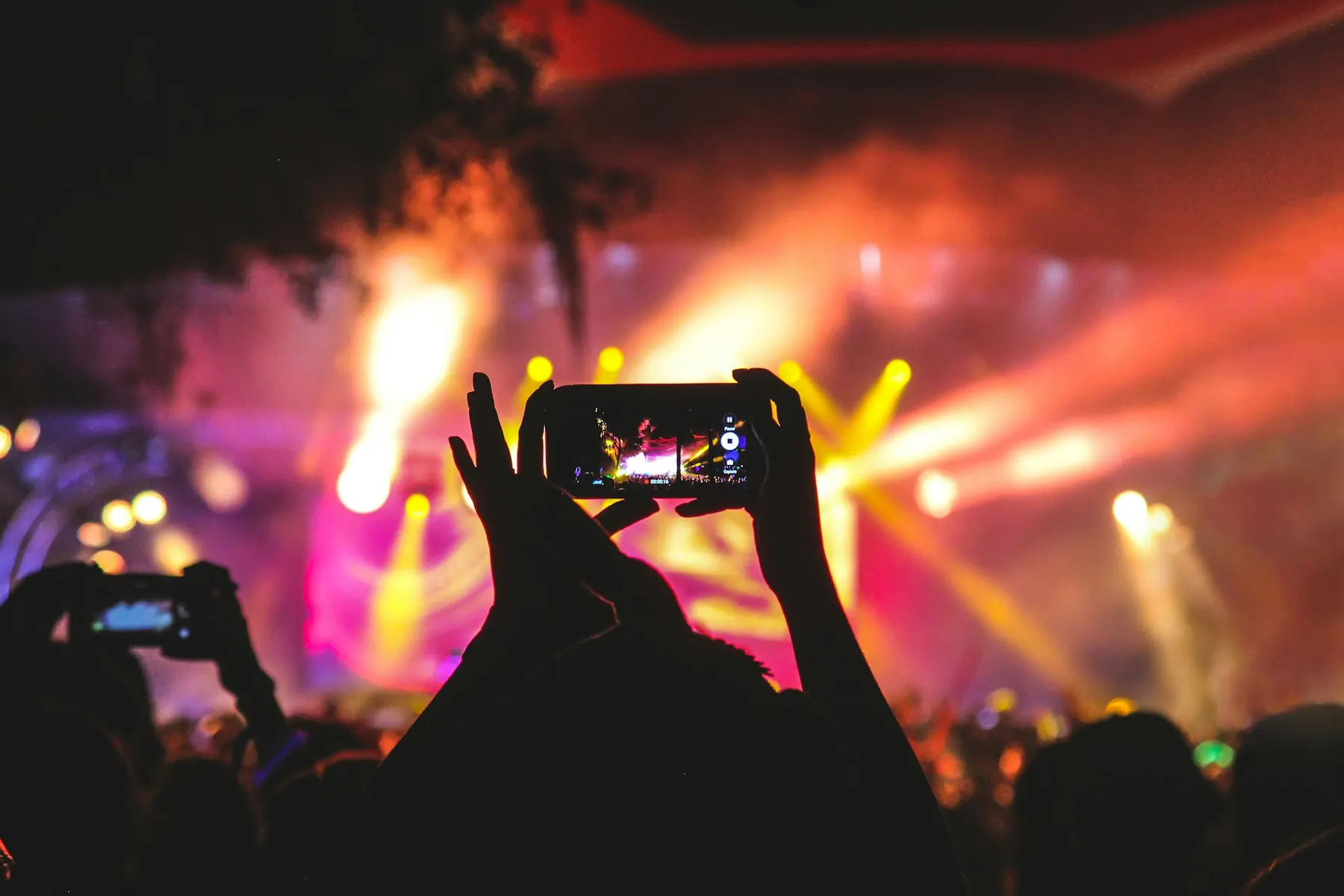A live performance on a stage in front of a crowd. Conceptual entertainment imagery.