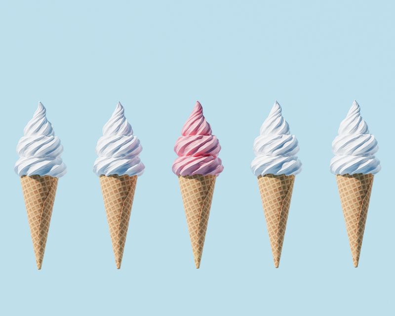 A row of soft-serve ice cream cones. Temporary concept photography.