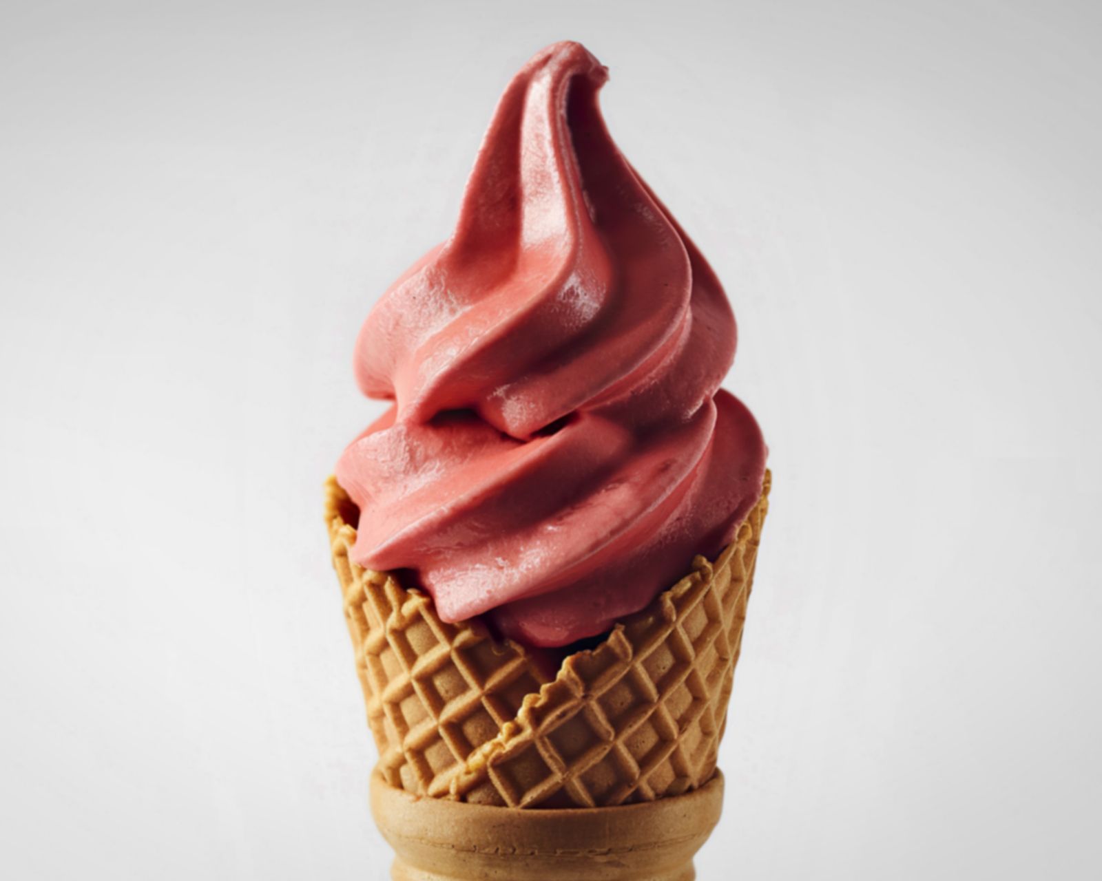 A pink soft-serve ice cream cone. Temporary concept photography.