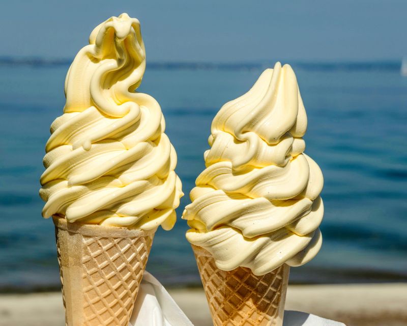 Two vanilla soft-serve ice cream cones. Temporary concept photography.